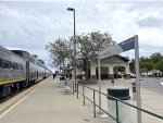 People enjoying fresh air on the platform at Merced Station